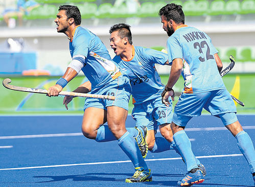 saving grace: India's VR Raghunath (left) celebrates after scoring against the Netherlands on Thursday. India lost the match 1-2. dh Photo/ K N Shanth kumar