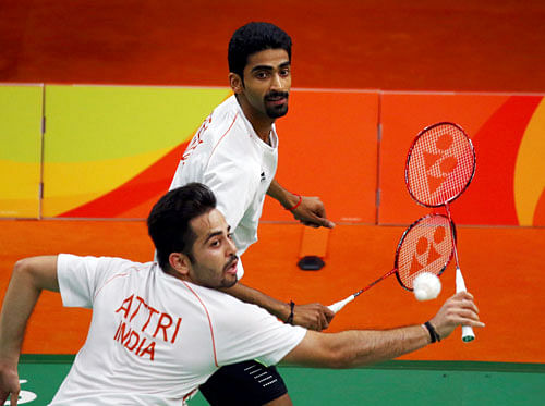 Manu Attri of India and B. Sumeeth Reddy of India play against Chai Biao of China and Hong Wei of China. REUTERS