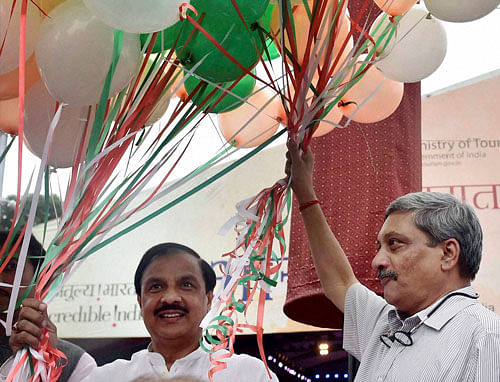 Defence Minister Manohar Parrikar with Union Minister Mahesh Sharma release balloons at the inauguration of Bharat Parv" organised as part of Independence Day celebrations, in New Delhi on Friday. PTI Photo