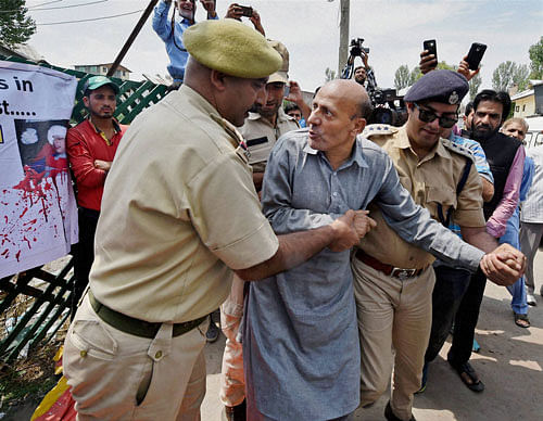 cops vs civilians: Police detain MLA Sheikh Abdul Rashid during a protest against civilian killings in Srinagar on Friday. PTI