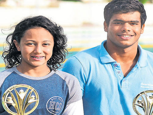 Champions: Saloni Dalal (left) and Arvind M, both from BAC, with their trophies on Friday. DH&#8200;PHOTO
