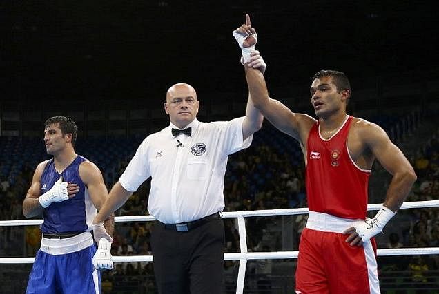 Vikas Krishan (IND) of India reacts after winning his bout against Onder Sipal (TUR) of Turkey.. Reuters