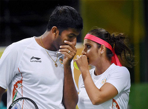 Sania Mirza And Rohan Bopanna play their mixed doubles match against S. Stosur and J. Peers of Australia during the 2016 Summer Olympics at Rio de Janeiro in Brazil on Thursday . PTI Photo