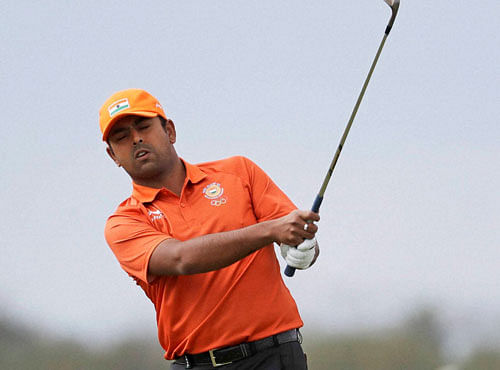 Anirban Lahiri of India watches his chip to the first hole during the first round of the men's golf event at the 2016 Summer Olympics in Rio de Janeiro, Brazil, Thursday, Aug. 11, 2016. AP/PTI
