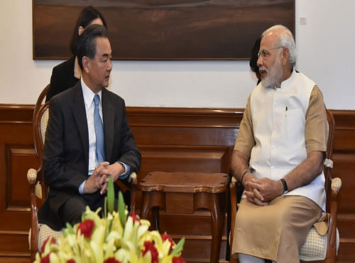 Chinese Foreign Minister Wang Yi today and Prime Minister Narendra Modi. Picture courtesy MEA