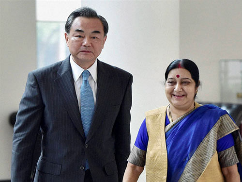 : External Affairs Minister Sushma Swaraj with her Chinese counterpart Wang Yi ahead of a meeting in New Delhi on Saturday. PTI Photo
