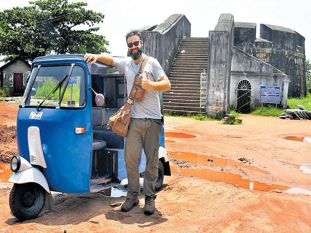 Arron James Attard with his autorickshaw at Sulthan Battery in Mangaluru.