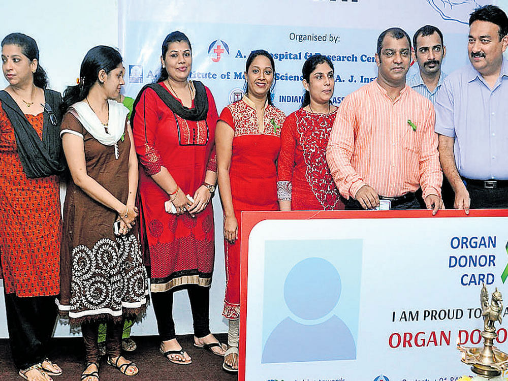 A&#8200;J&#8200;Hospital and Research Centre Medical Director Dr Prashanth K&#8200;Marla distributes organ donor card, on account of World Organ&#8200;Donation Day, in&#8200;Mangaluru on Saturday.