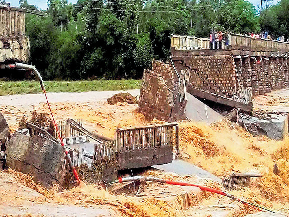A portion of the Chaunch Khad-Indora-Kandrori bridge was washed away by the floods at Indora in Nurpur,  Himachal Pradesh. PTI