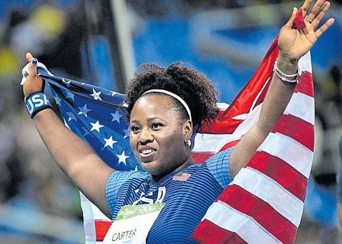 Deserving champion Michelle Carter of the US&#8200;celebrates after winning the shot put final at the Olympic Stadium on Saturday. AFP
