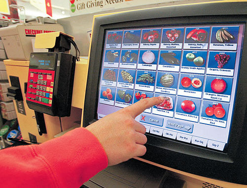 A file photo of a customer going through self-checkout at a grocery shop in New York. INYT