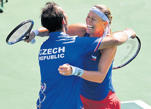 over the moon: Czech Republic's Radek Stepanek (left) and Lucie Hradecka are overjoyed after beating India's Sania Mirza and Rohan Bopanna to clinch the mixed doubles bronze on Sunday. DH PHOTO/ K N SHANTH KUMAR