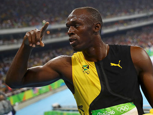 Usain Bolt (JAM) of Jamaica celebrates winning the gold medal. REUTERS