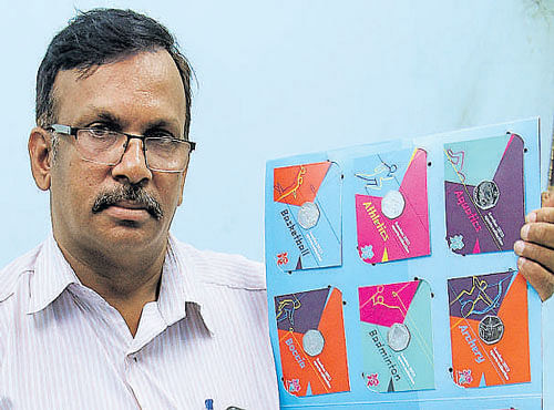 Jagannath Mani with his stamp collection.