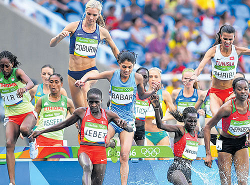 TACKLING OBSTACLES: Bahrain's Ruth Jebet leads the way in the women's 3000M steeplechase event where India's Lalita Babar finished 10th. DH PHOTO