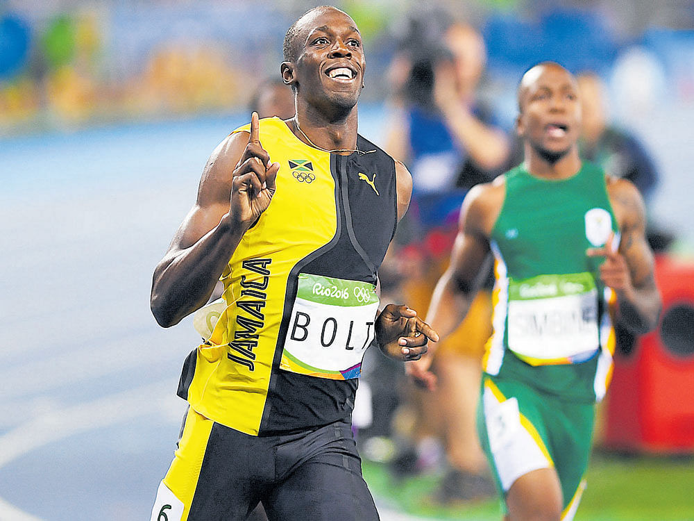 Usain Bolt of Jamaica celebrates after winning the 100M dash at the Rio Olympics on Sunday. The sprint legend won the race in 9.81 seconds. DH photo/K N Shanth Kumar
