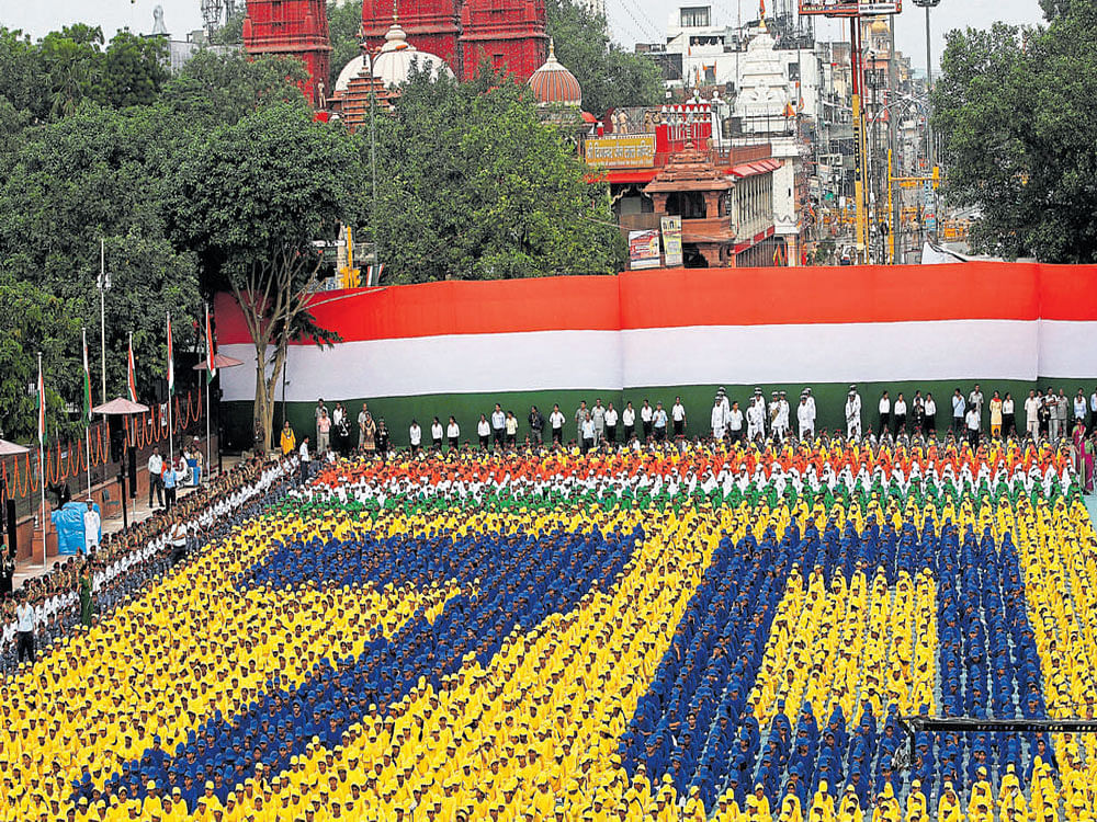 Schoolchildren take part in the Independence Day celebrations in front of the historic Red Fort in New Delhi. PTI