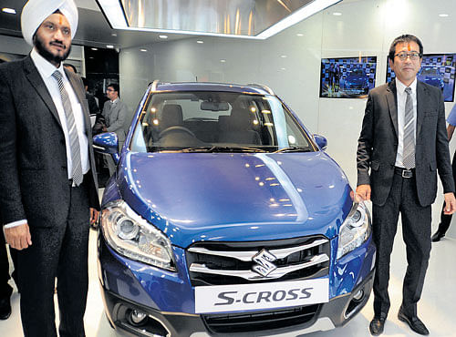 A file photo of Maruti Suzuki launching NEXA-a premium automotive experience-with its first premium crossover S Cross, last year. The dealership is owned by Bimal Auto Agency, located at Doddanekkundi Outer Ring Road, Mahadevapura, in Bengaluru. Maruti Suzuki India Executive Director (Marketing and Sales) T Hashimoto (right), and Executive Director (Domestic Sales and Marketing) RS Kalsiwere present during the launch. DH FILE PHOTO