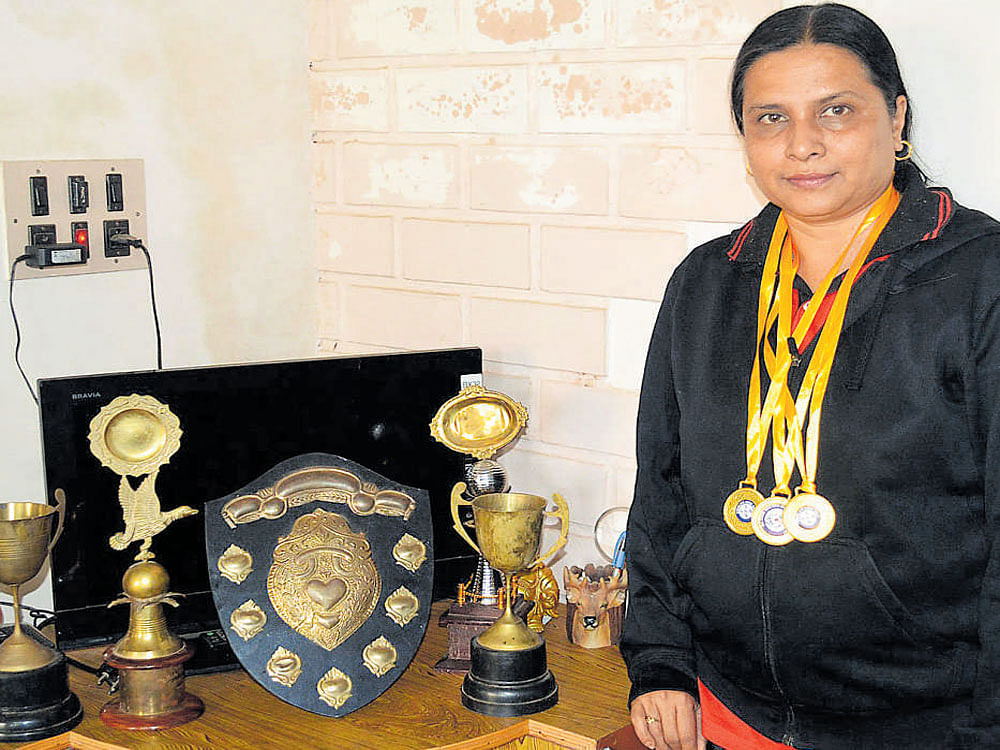 Sapna Benji displays her medals.