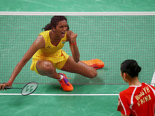 P.V. Sindhu (IND) of India celebrates after winning her match against Wang Yihan (CHN) of China. REUTERS