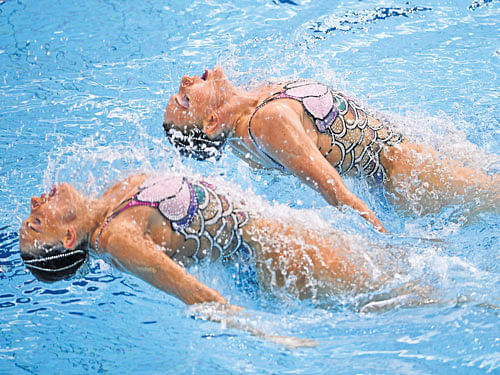 mermaids Russia's Natalia Ishchenko (left) and Svetlana Romashina during the duet  technical routine in the final of synchronised swimming at the Maria Lenk Aquatics. AFP