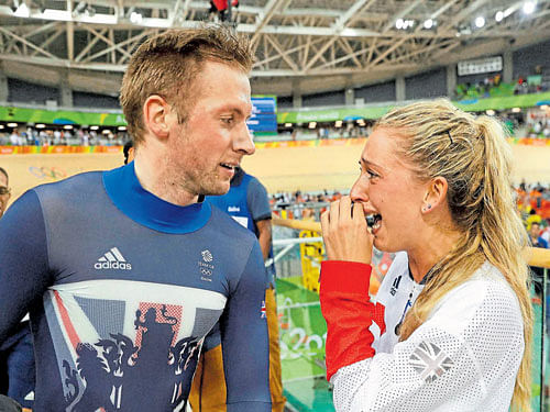 power couple British cyclist Laura Trott, a four gold medal winner at this Games, is overcome by emotion after her fiance Jason Kenny wins the keirin race on Tuesday. ap/ pti