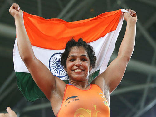 Sakshi Malik (IND) of India celebrates winning the bronze medal. REUTERS