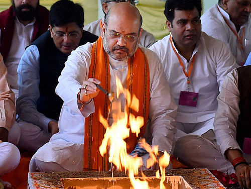 BJP President Amit Shah performs prayers during the "bhoomi poojan" for the start of construction work for the new BJP headquarters at Deendayal Upadhyaya (DDU) Marg in New Delhi on Thursday. PTI Photo