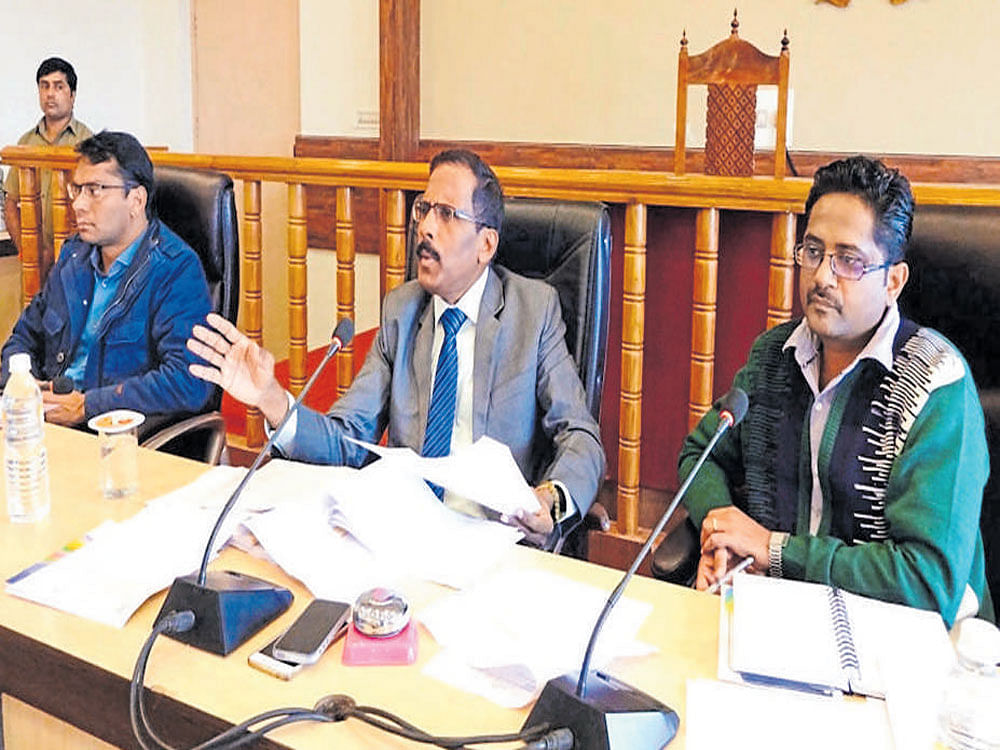 Deputy Commissioner Richard Vincent D'Souza addresses officials at a meeting in Madikeri on Thursday. DH photo