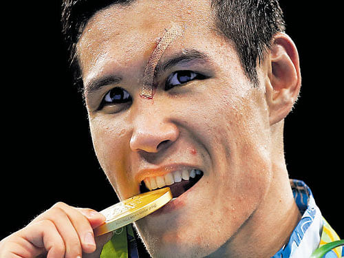 sweet taste of success Daniyar Yeleussinov with his gold medal at the Rio Olympics. AFP
