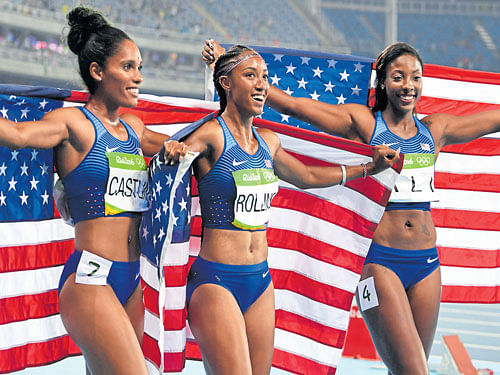girl power Brianna Rollins (centre), Nia Ali (right) and Kristi Castlin celebrate a US 1-2-3 in the women's 100M hurdles on Wednesday. dh photo