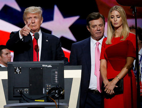 Republican presidential nominee Donald Trump gives a thumbs up as his campaign manager Paul Manafort (C) and daughter Ivanka (R) look on during Trump's walk through at the Republican National Convention in Cleveland, U.S., July 21, 2016. REUTERS/File Photo