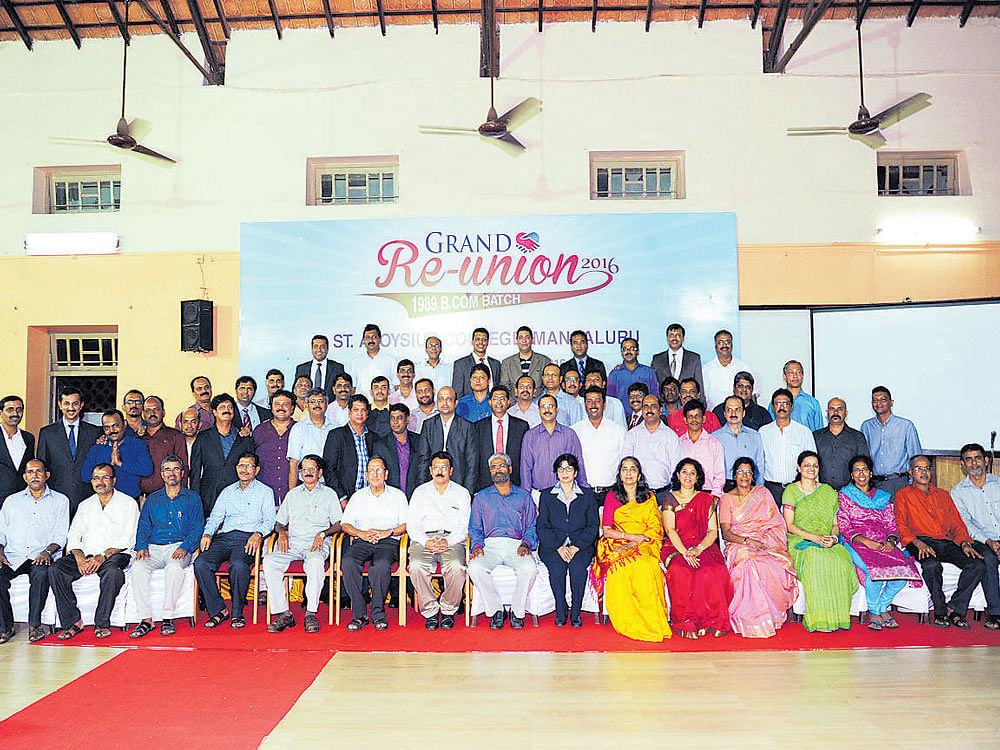 The students of 1989 BCom batch of St Aloysius College pose for a photograph with their teachers at the alumni meet.