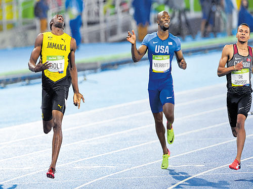 a cut above the rest: Jamaican Usain Bolt (first from left) leaves the 200M field behind him for his second gold of the meet in Rio de Janeiro on Thursday. dh photo/ k n shanth kumar