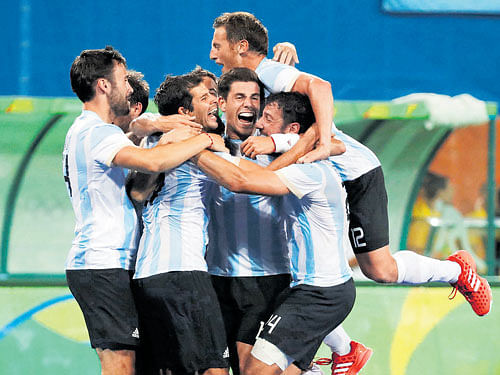 champions: Argentine players celebrate after winning the gold medal match against Belgium on Thursday. reuters