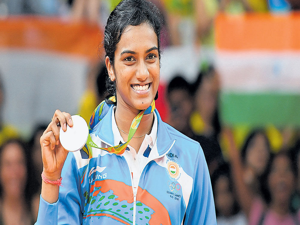 P V Sindhu with her silver medal after she lost to Spain's Carolina Marin in the women's badminton singles final in  Rio de Janeiro in Brazil on Friday. DH Photo/K N Shanth Kumar