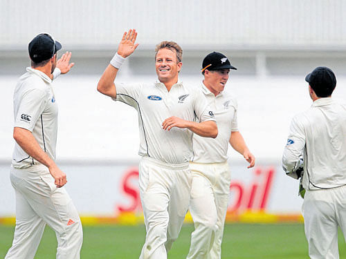 Destructive New Zealand pacer Neil Wagner (centre) celebrates the scalp of JP Duminy on the first day of the first Test against South Africa on Friday. AFP