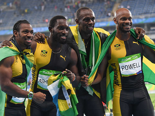 Champions: (From left) Jamaica's Yohan Blake, Nickel Ashmeade, Usain Bolt and Asafa Powell celebrate after winning the 4x100M relay final. DH photo/ KN Shanth Kumar