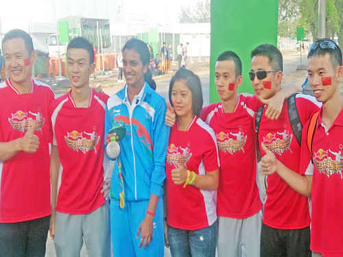 Fans from across border: A bunch of Chinese fans pose for a photo with India's PV Sindhu in Rio de Janeiro.