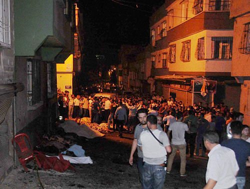 People gather after an explosion in Gaziantep, southeastern Turkey, early Sunday, Aug. 21, 2016. Gaziantep Province Gov. Ali Yerlikaya said the deadly blast, during a wedding near the border with Syria, was a terror attack. AP/PTI