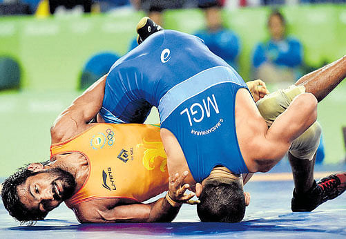 disappointing India's Yogeshwar Dutt couldn't live up to expectations and crashed out in first round against Mongolia's Ganzorig Mandakhnaran on Sunday. afp