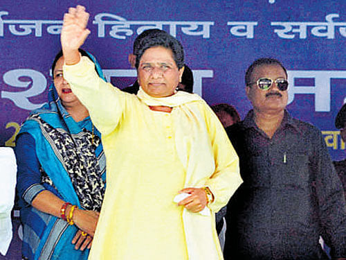 Bahujan Samaj Party chief Mayawati waves at the crowd  during a mega rally in Agra on Sunday. PTI