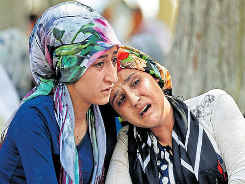 Women mourn as they wait in front of a hospital morgue in the Turkish city of Gaziantep on Sunday. REUTERS