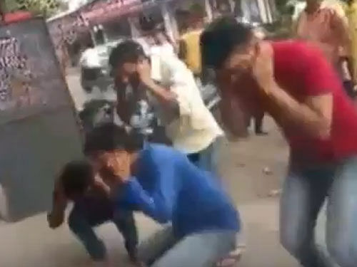 Workers at a bakery here were made to do sit-ups allegedly by members of a local Ganesh Mandal for refusing to pay them donation for the upcoming festival, police said today. Screengrab