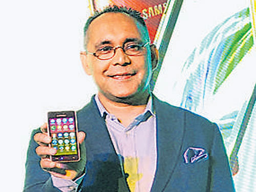 Samsung India Electronics Vice President (Mobile Business) Manu Sharma unveils Z2 smartphone in New Delhi on Tuesday.