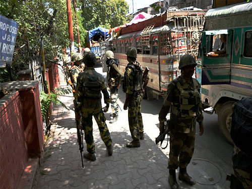 Fresh BSF troops arrive to strengthen security measures during curfew and strike in Srinagar on Tuesday. PTI Photo