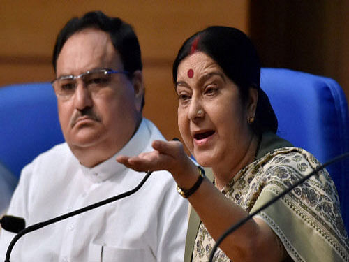 External Affairs Minister Sushma Swaraj and Union Health Minister J P Nadda addressing a press conference after the Union Cabinet gave its approval for introduction of Surrogacy (Regulation) Bill, 2016, at national media centre in New Delhi on Wednesday. PTI Photo
