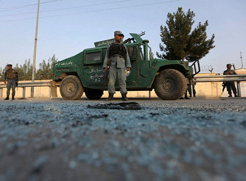 Afghan security forces stand guard after an attack on the American University of Afghanistan in Kabul, Afghanistan. The attack has ended, a senior police officer said Thursday, after several people were killed. Kabul police Chief Abdul Rahman Rahimi said the dead included one guard, and that about 700 students had been rescued. AP/PTI