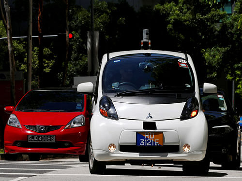 A nuTonomy self-driving taxi drives on the road in its public trial in Singapore. REUTERS Photo