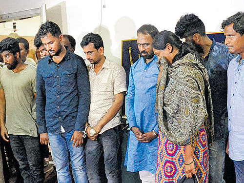 The eight-member gang, which kidnapped two real estate businessmen for extortion, is paraded at a press conference in Bengaluru on Thursday. DH&#8200;PHOTO
